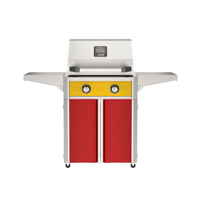 American Outdoor Grill 24" T-Series Portable Gas Grill with yellow accent panel and red accent panel cart base, large analog thermometer and push-button electronic ignition with backlit comfort-touch control knobs.
