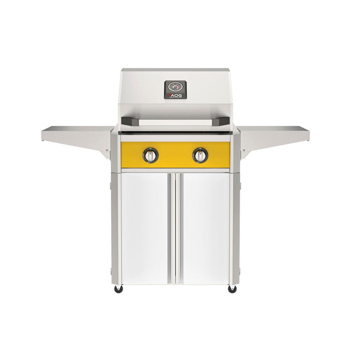 American Outdoor Grill 24" T-Series Portable Gas Grill with yellow accent panel and white accent panel cart base, large analog thermometer and push-button electronic ignition with backlit comfort-touch control knobs.
