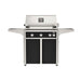 American Outdoor Grill 30" L-Series Portable Gas Grill with black accent panel and black accent panel cart base, large analog thermometer and push-button electronic ignition with backlit comfort-touch control knobs.
