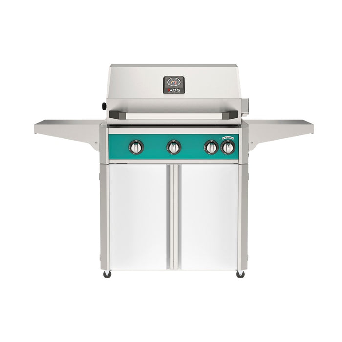 American Outdoor Grill 30" L-Series Portable Gas Grill with teal accent and white accent panel cart base, large analog thermometer and push-button electronic ignition with backlit comfort-touch control knobs.
