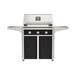 American Outdoor Grill 30" T-Series Portable Gas Grill with black accent panel and black accent panel cart base, large analog thermometer and push-button electronic ignition with backlit comfort-touch control knobs.

