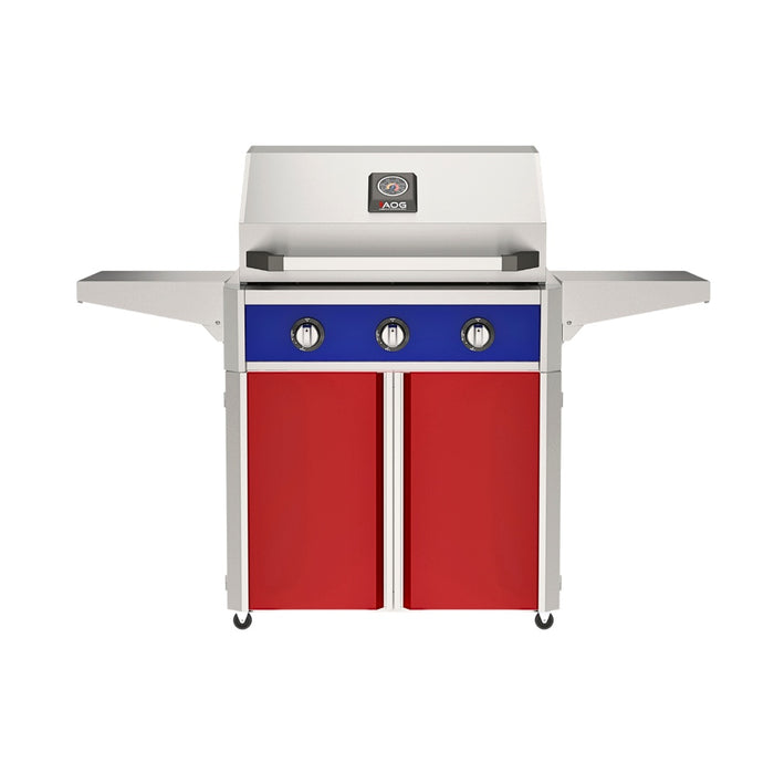 American Outdoor Grill 30" T-Series Portable Gas Grill with blue accent panel and red accent panel cart base, large analog thermometer and push-button electronic ignition with backlit comfort-touch control knobs.
