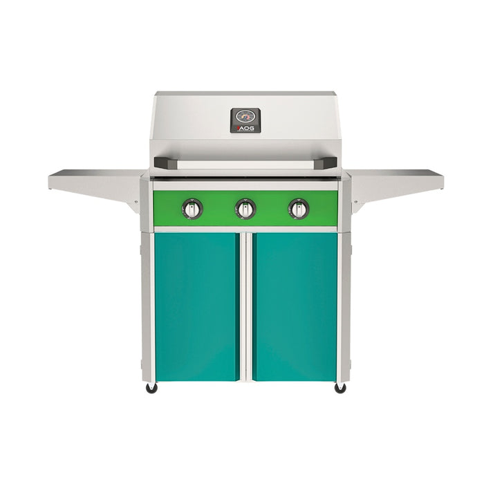 American Outdoor Grill 30" T-Series Portable Gas Grill with green accent panel and teal accent panel cart base, large analog thermometer and push-button electronic ignition with backlit comfort-touch control knobs.
