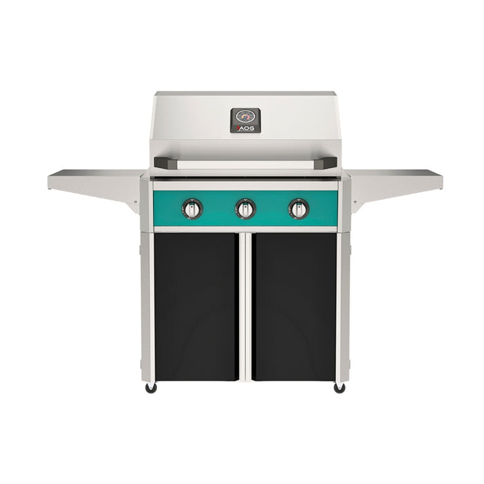 American Outdoor Grill 30" T-Series Portable Gas Grill with teal accent panel and black accent panel cart base, large analog thermometer and push-button electronic ignition with backlit comfort-touch control knobs.
