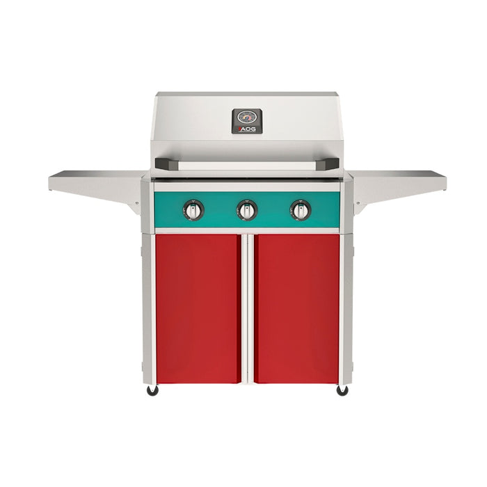 American Outdoor Grill 30" T-Series Portable Gas Grill with teal accent panel and red accent panel cart base, large analog thermometer and push-button electronic ignition with backlit comfort-touch control knobs.
