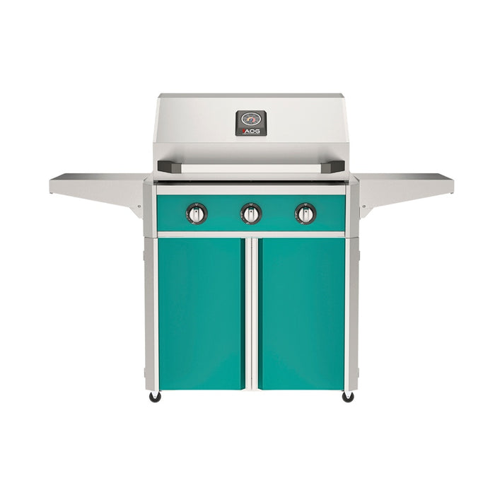 American Outdoor Grill 30" T-Series Portable Gas Grill with teal accent panel and teal accent panel cart base, large analog thermometer and push-button electronic ignition with backlit comfort-touch control knobs.
