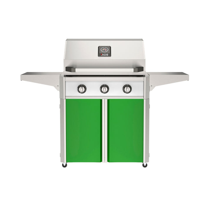 American Outdoor Grill 30" T-Series Portable Gas Grill with white accent panel and green accent panel cart base, large analog thermometer and push-button electronic ignition with backlit comfort-touch control knobs.
