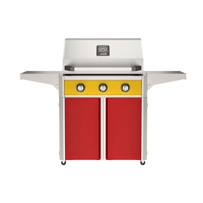 American Outdoor Grill 30" T-Series Portable Gas Grill with yellow accent panel and red accent panel cart base, large analog thermometer and push-button electronic ignition with backlit comfort-touch control knobs.
