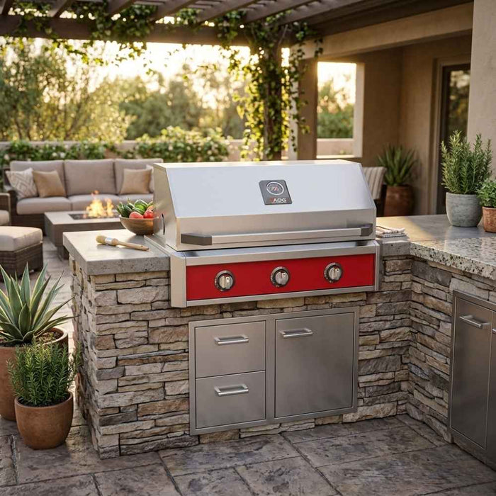 American Outdoor Grill 36" T-Series Built-In Gas Grill (AOG36TN) installed in a stacked stone outdoor kitchen island with a dark granite countertop on a luxury patio setting.