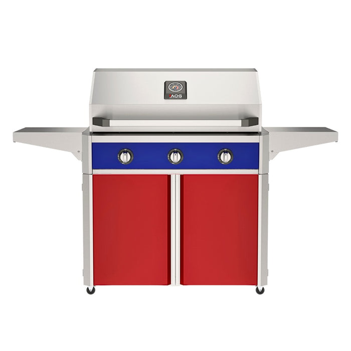 American Outdoor Grill 36" T-Series Portable Gas Grill with blue accent panel and red accent panel cart base, large analog thermometer and push-button electronic ignition with backlit comfort-touch control knobs.
