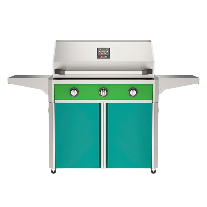 American Outdoor Grill 36" T-Series Portable Gas Grill with green accent panel and teal accent panel cart base, large analog thermometer and push-button electronic ignition with backlit comfort-touch control knobs.
