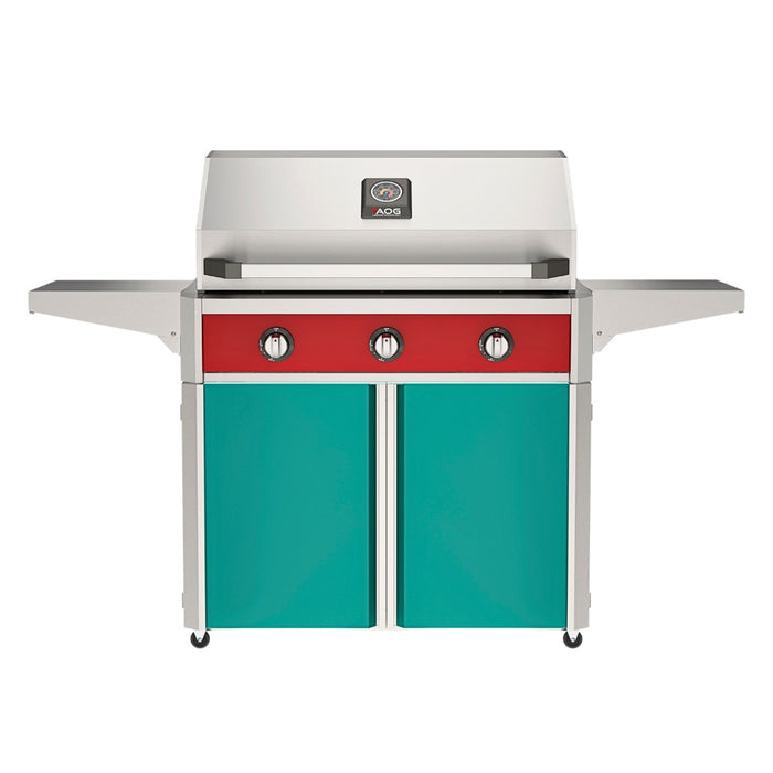 American Outdoor Grill 36" T-Series Portable Gas Grill with red accent panel and teal accent panel cart base, large analog thermometer and push-button electronic ignition with backlit comfort-touch control knobs.

