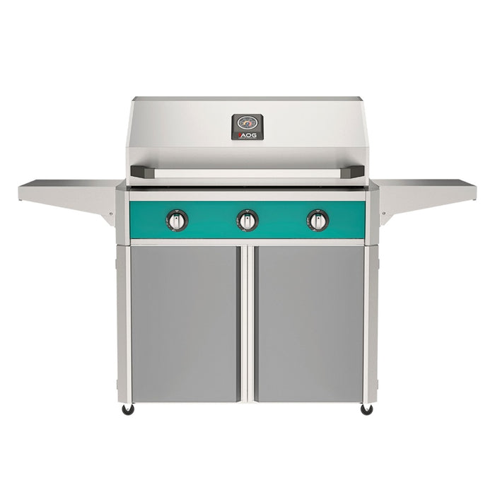 American Outdoor Grill 36" T-Series Portable Gas Grill with teal accent panel and gray accent panel cart base, large analog thermometer and push-button electronic ignition with backlit comfort-touch control knobs.
