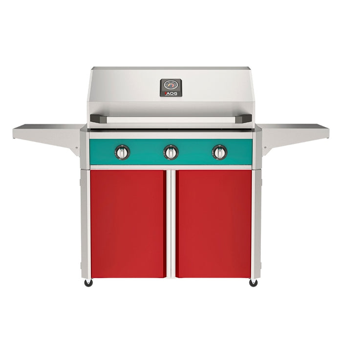 American Outdoor Grill 36" T-Series Portable Gas Grill with teal accent panel and red accent panel cart base, large analog thermometer and push-button electronic ignition with backlit comfort-touch control knobs.
