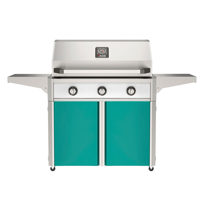American Outdoor Grill 36" T-Series Portable Gas Grill with white accent panel and teal accent panel cart base, large analog thermometer and push-button electronic ignition with backlit comfort-touch control knobs.
