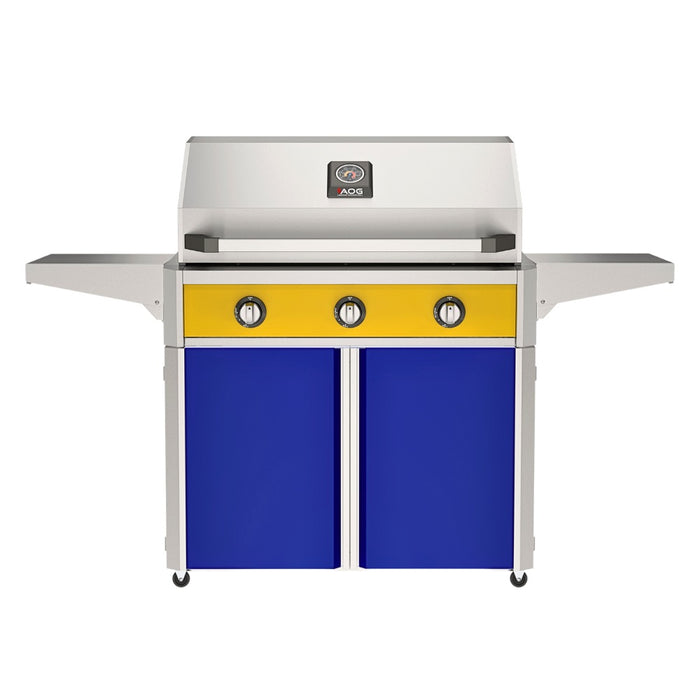 American Outdoor Grill 36" T-Series Portable Gas Grill with yellow accent panel and blue accent panel cart base, large analog thermometer and push-button electronic ignition with backlit comfort-touch control knobs.

