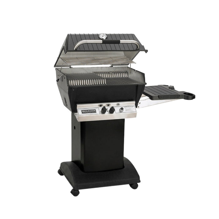 Broilmaster P3X Super Premium Cast Aluminum Gas Grill Head with black solid surface side shelf and black cart base.