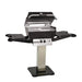 Broilmaster P4X Super Premium Cast Aluminum Gas Grill Head with black solid surface side shelves and stainless steel 26" patio post.

