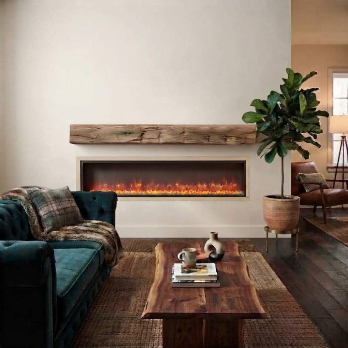 Fireside finishings weathered barnwood non-combustible mantel shelf installed above a linear electric fireplace in a modern living room.
