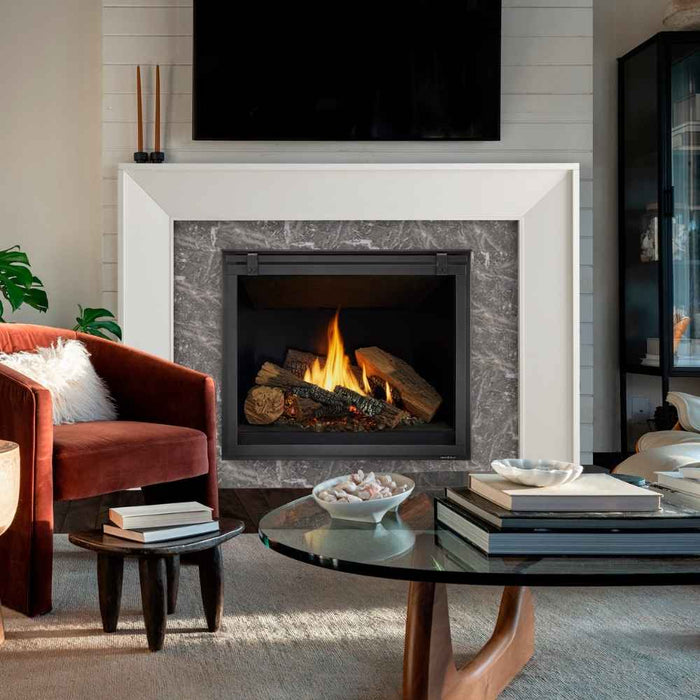 Modern gas fireplace with grey marble surround and zimmer flush wood mantel installed in a contemporary living room.