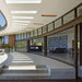 Infratech WD-series electric patio heater   recessed into the curved architectural eave of a modern luxury breezeway.
