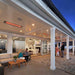 Infratech WD-series electric patio heaters seamlessly recessed into the tongue-and-groove ceiling of a modern luxury veranda