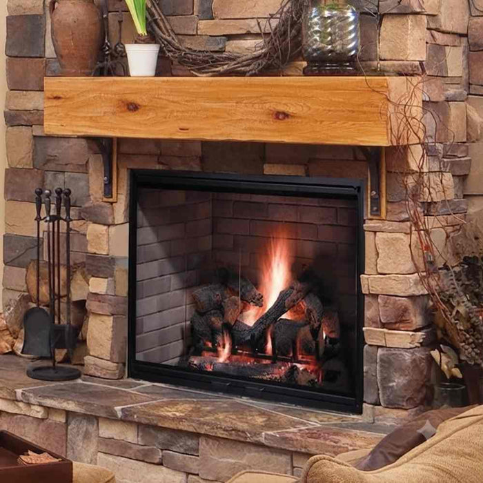 Majestic Biltmore wood burning fireplace installed with black glass bi-fold door