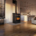 Osburn Gusto wood burning cookstove with black decorative molding in a modern kitchen and living space.