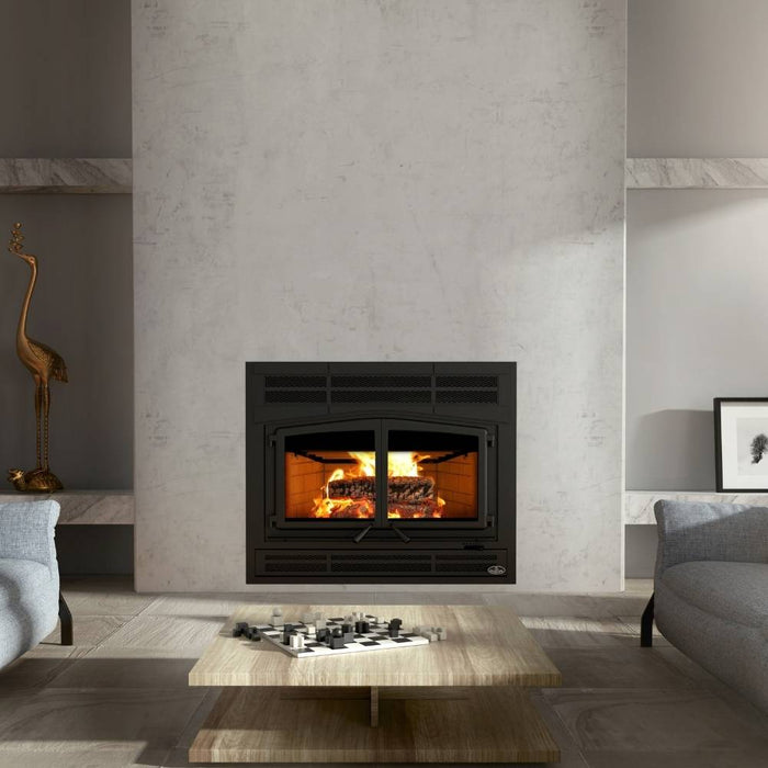 Osburn Horizon high efficiency wood burning fireplace with black prairie style faceplate and classic moulded brick panels in a modern minimalist living room with grey concrete walls.