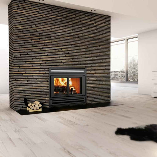 Valcourt Manoir Wood Burning Fireplace installed in a modern living room featuring a double door fireplace hearth embedded into a massive, floor-to-ceiling accent wall