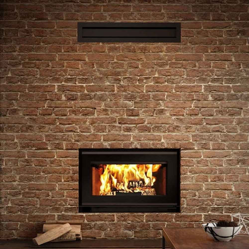 Modern gravity hot air distribution kit for valcourt fireplace shown installed in a customized wall