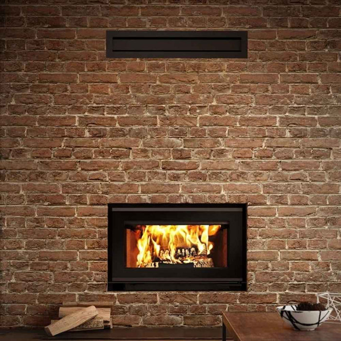 Modern gravity hot air distribution kit for valcourt fireplace shown installed in a customized wall