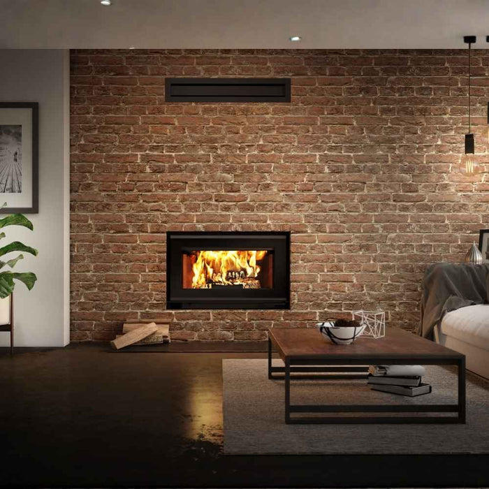 Valcourt Mundo II high efficiency wood burning fireplace with modern gravity kit installed in a living room