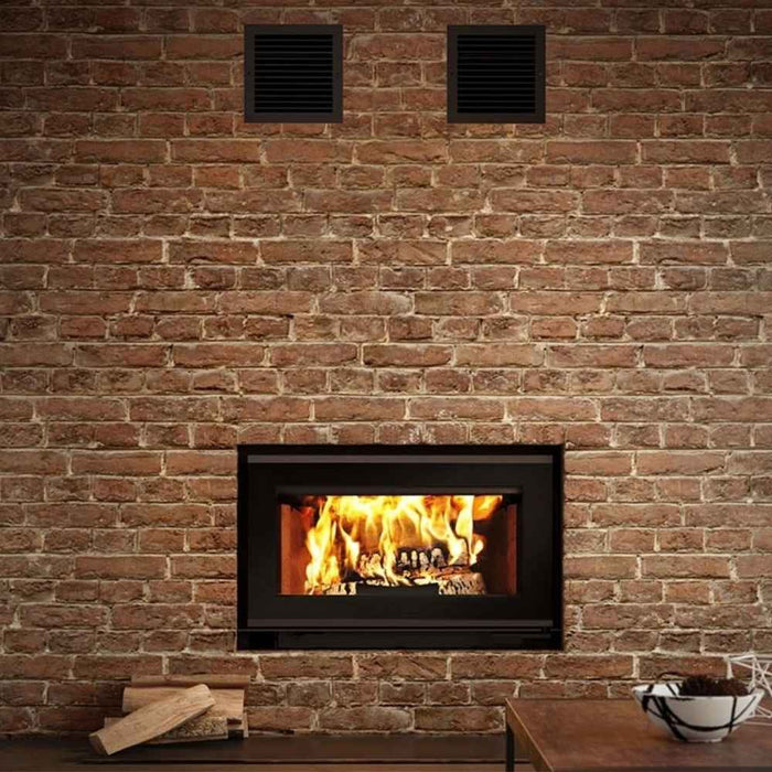 Traditional gravity hot air distribution kit for valcourt fireplace shown installed in a customized wall