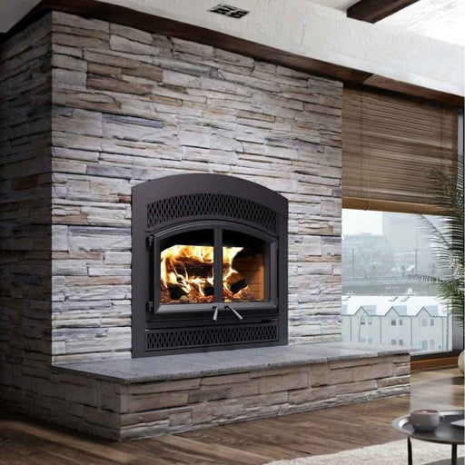 Valcourt Waterloo arched faceplate high efficiency wood burning fireplace with classic moulded brick panels, black arched faceplate and with classic style faceplate louver installed in a customized wall in a modern livingroom 